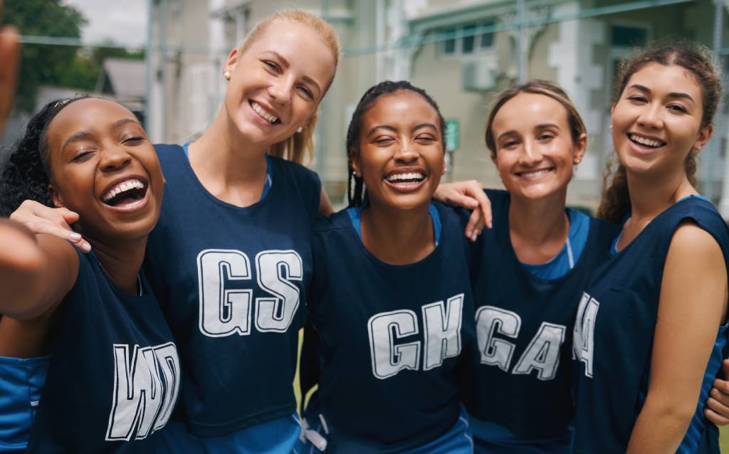 5 members of a womens college basketball team.
