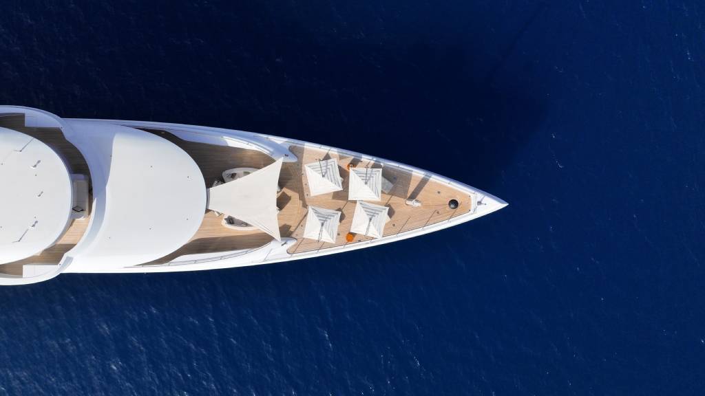 A top-down shot of a yacht’s bow.