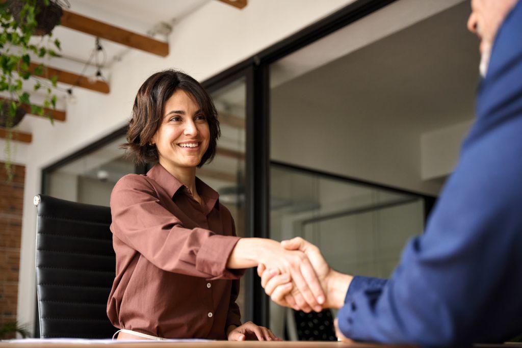 A young worker shaking hands with a hiring manager