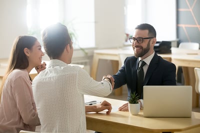 Business owners meet with insurance agent