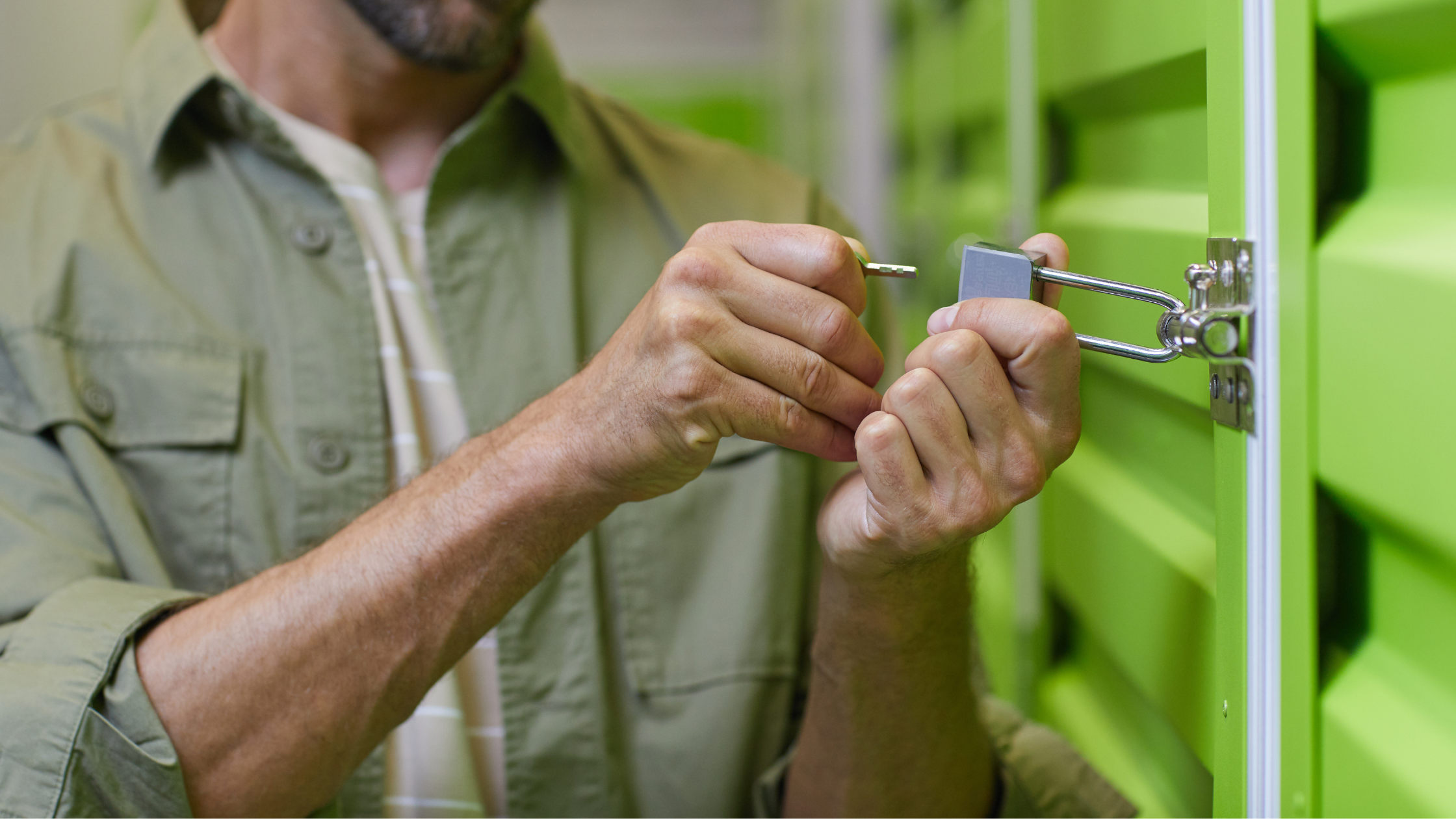 man locking a storage unit