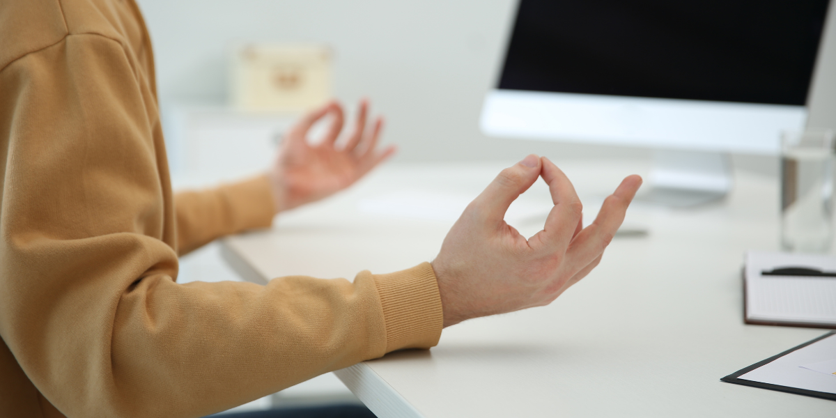 Employee Meditating at Desk