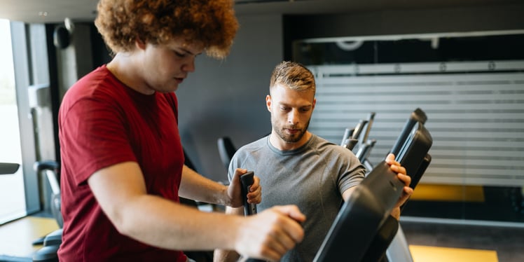 Personal trainer and client