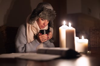 Woman trying to stay warm during power outage