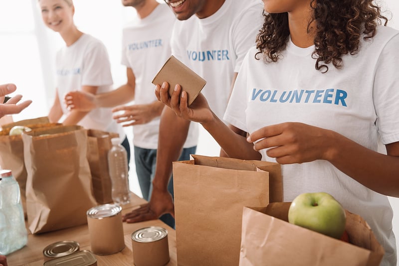 volunteers assembling food packages