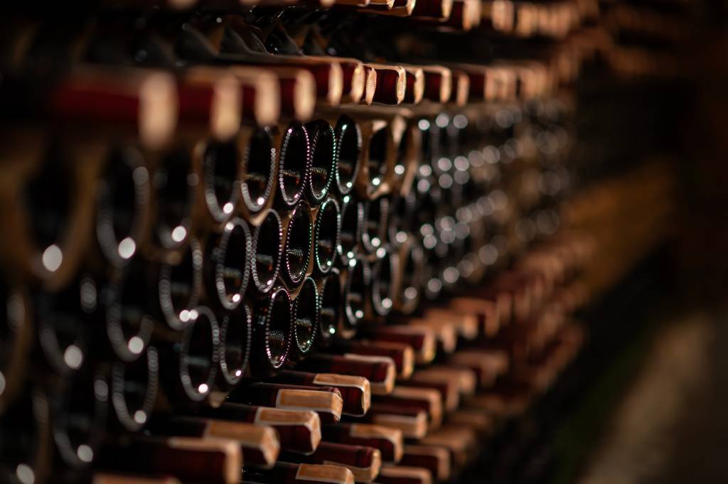 Bottles of wine in a wine rack.