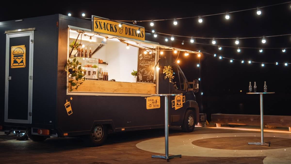 Food truck set up at night with lights 
