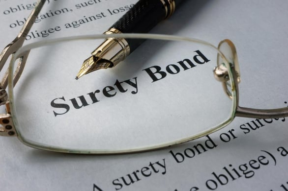 Surety bond paperwork on desk