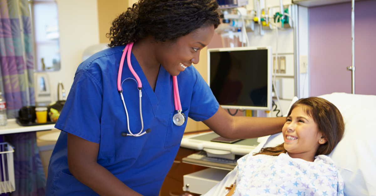 pediatric nurse with smiling patient