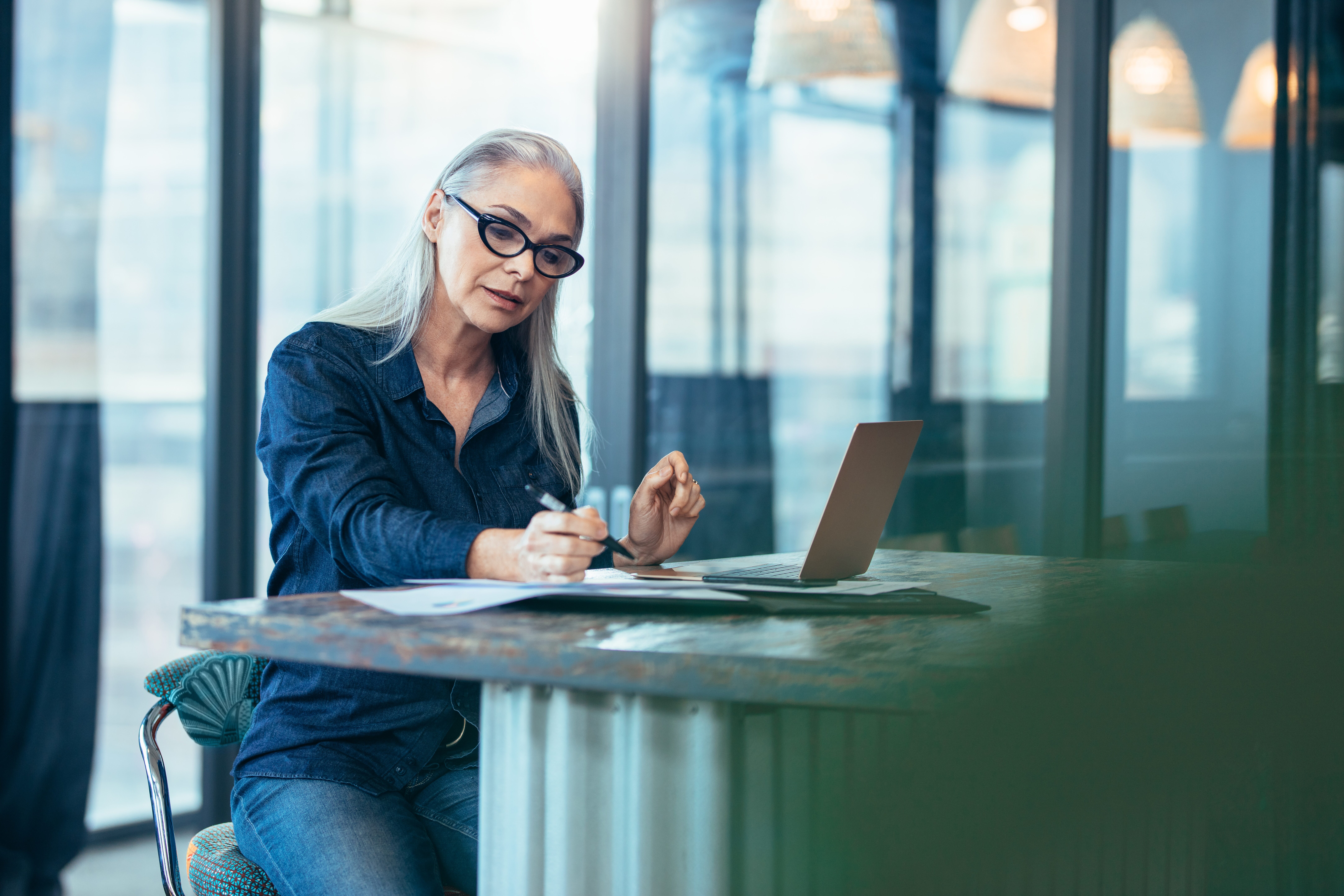 Women working with pen and laptop