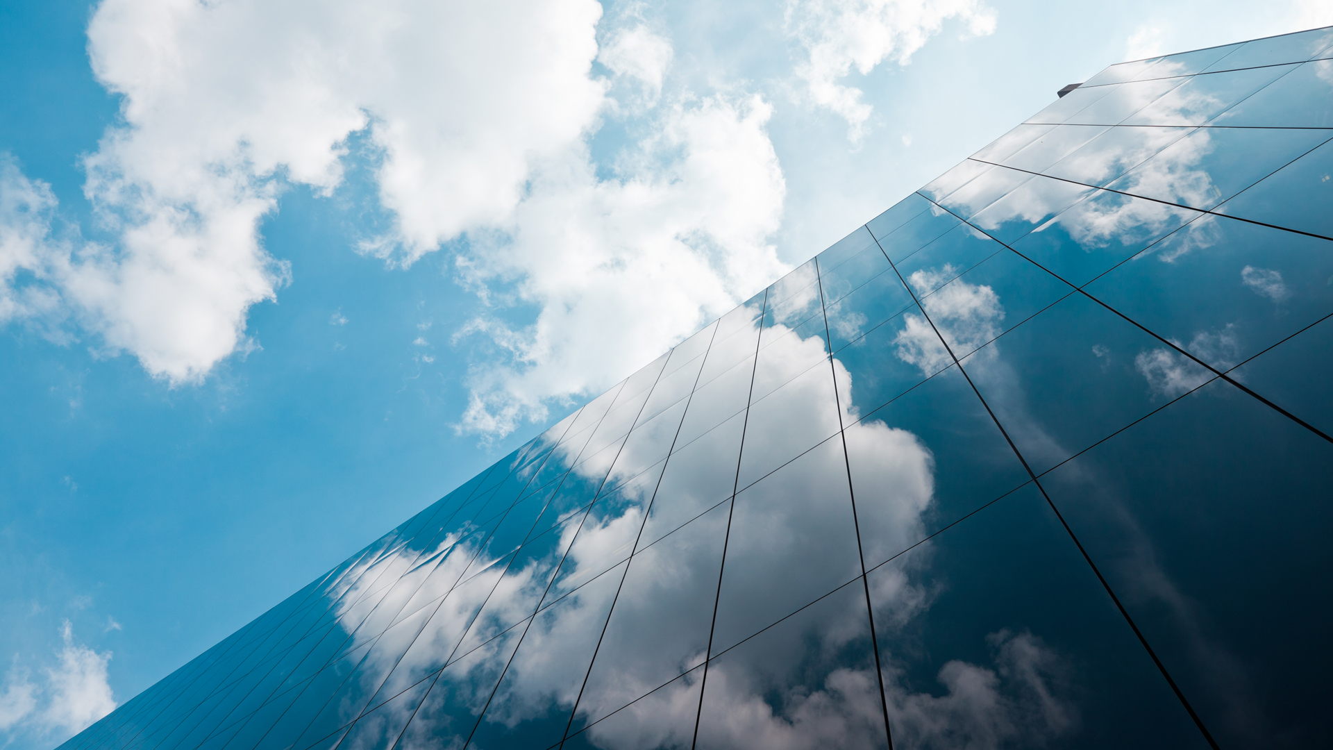 A building reflecting clouds