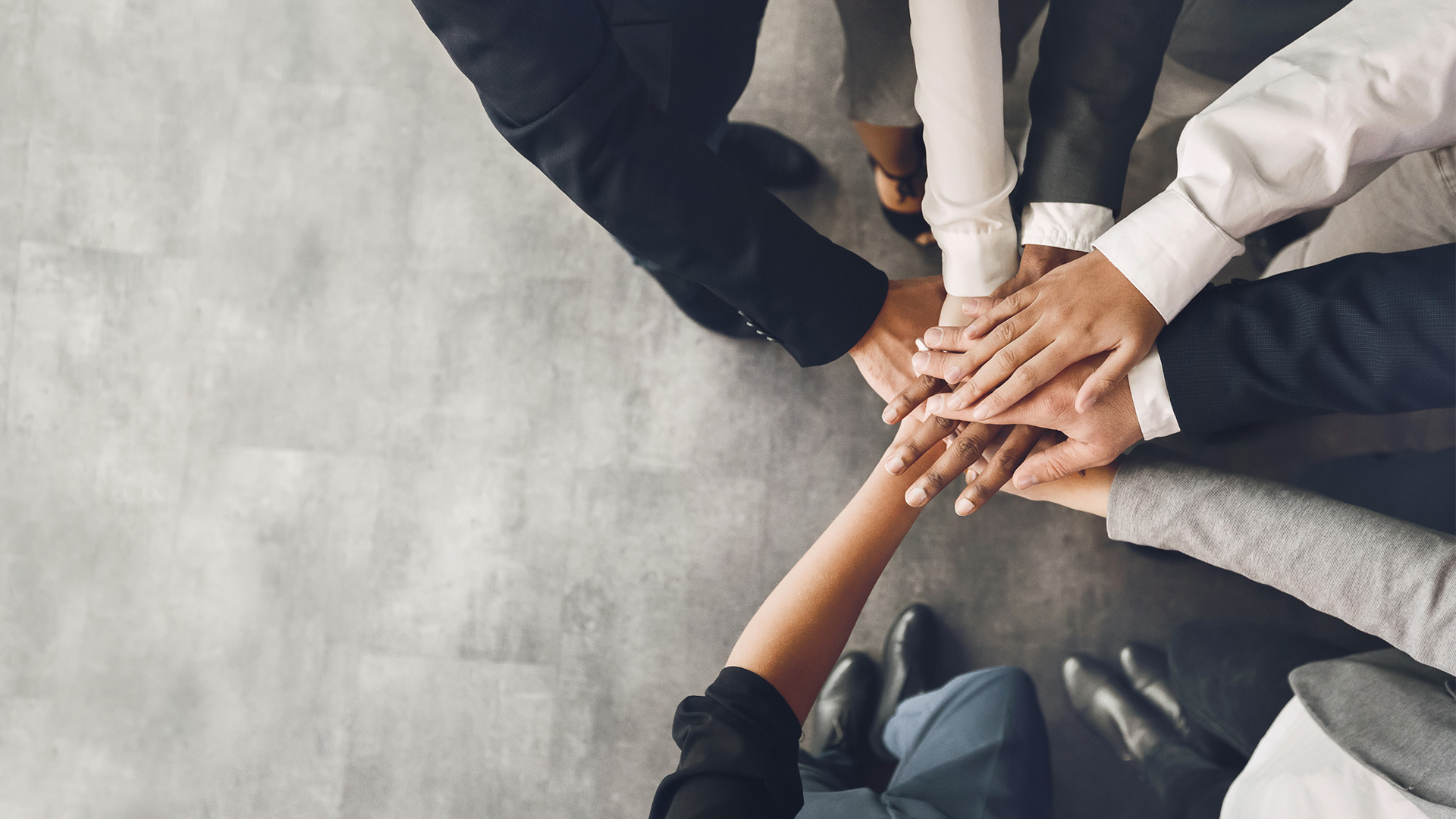 Team huddle hands together